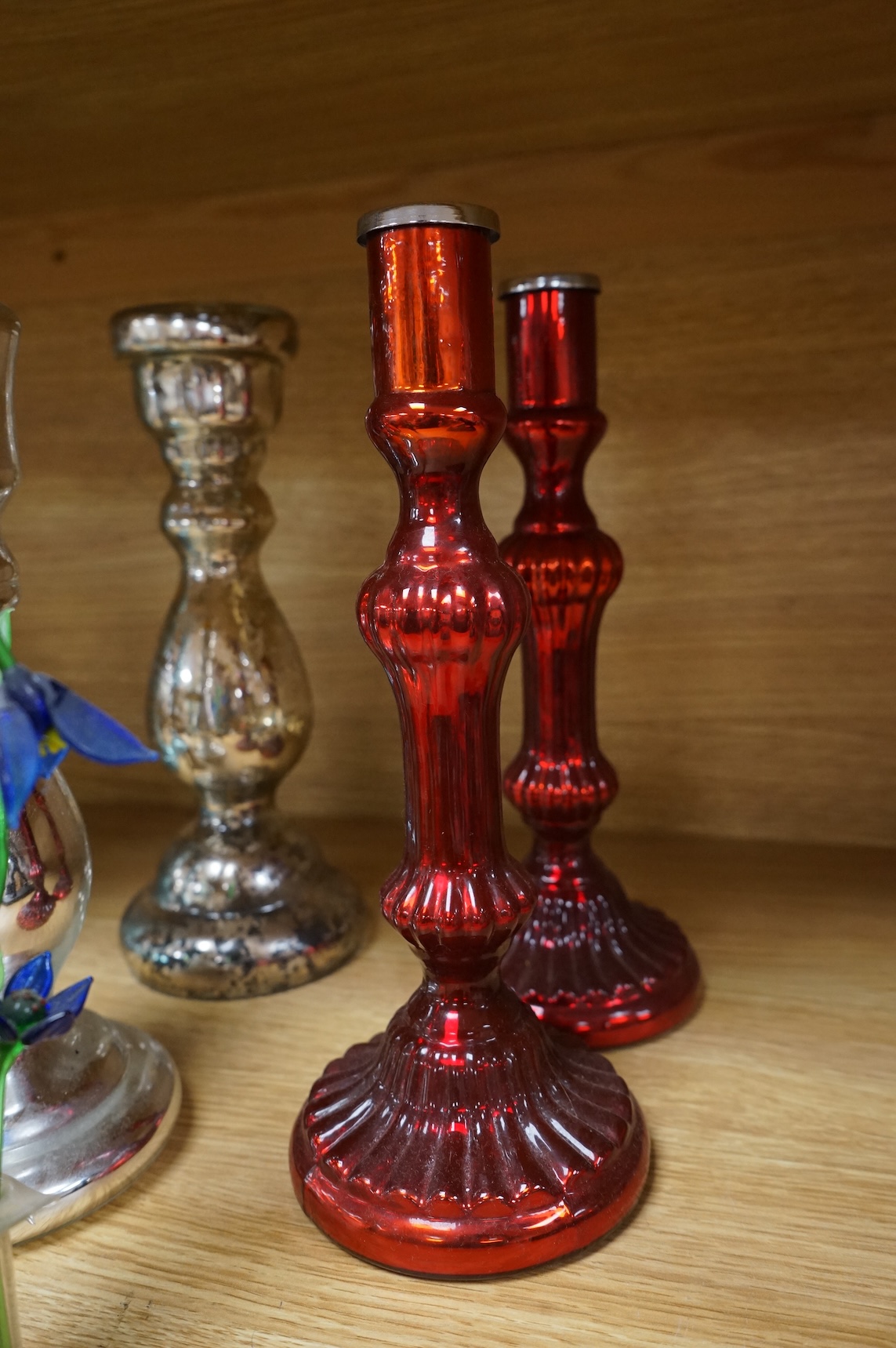 Three pairs of mirrored glass candlesticks and two small glass floral displays, largest 26cm high